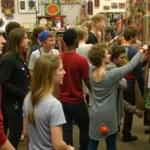 A vibrant display of various thrifted items, including clothes, furniture, and home decor, emphasizing the joy of second-hand shopping.